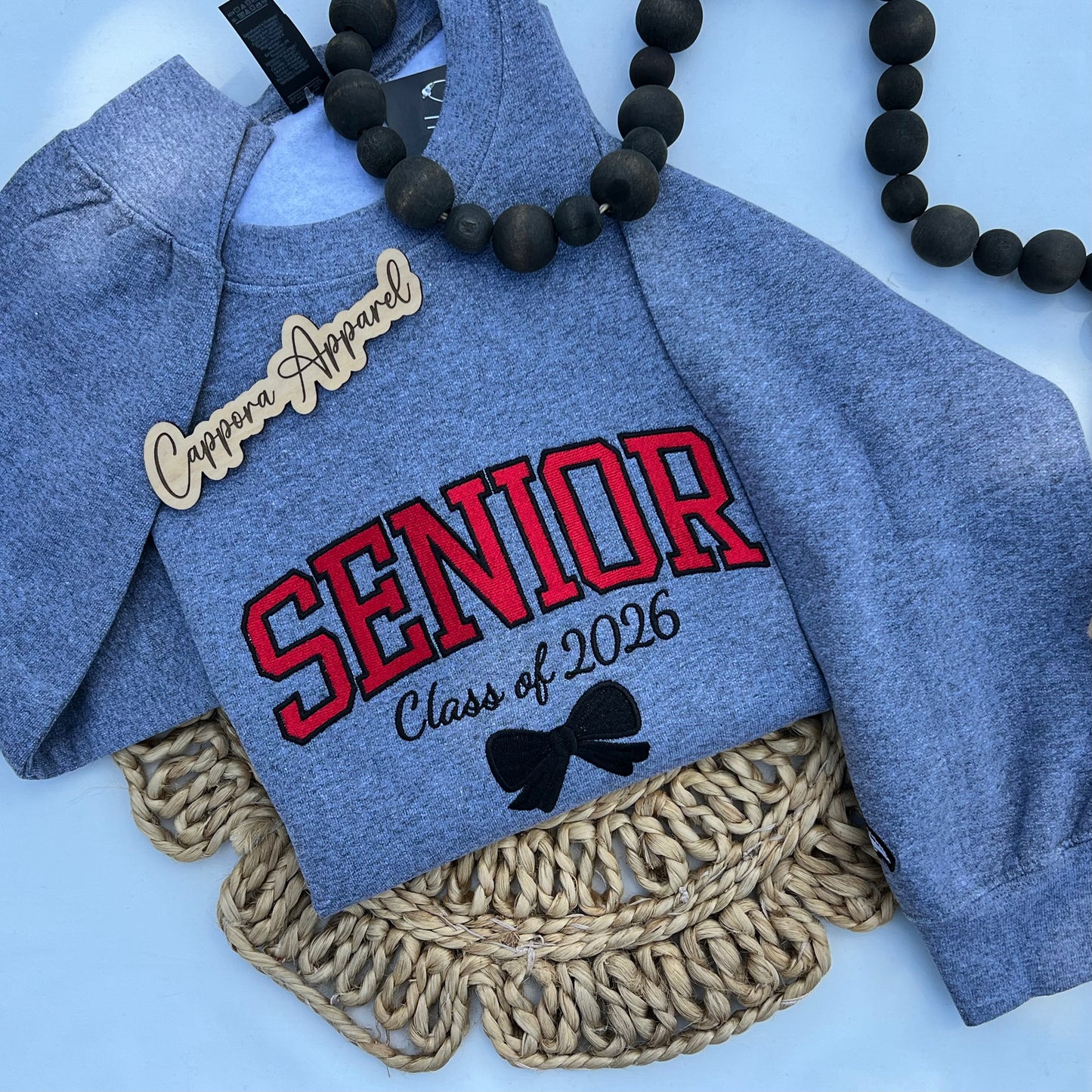 Celebrate graduation in style with our embroidered Senior Class of [Year] Gildan crewneck. Cozy fleece, custom embroidery, and perfect senior gift apparel!