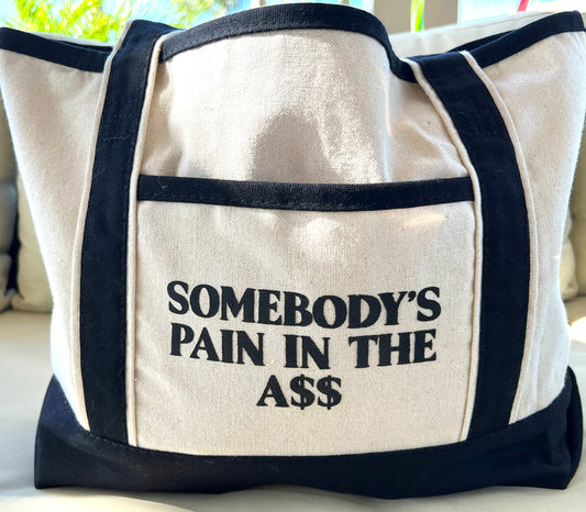 Somebody’s Pain In The Ass Tote Bag – Funny Canvas Shopper Bag, Sassy Reusable Market Tote, Bold Quote Gift for Women & Friends