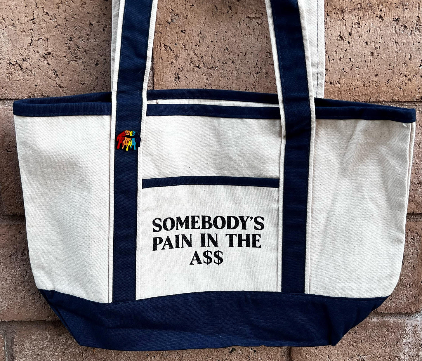 Somebody’s Pain In The Ass Tote Bag – Funny Canvas Shopper Bag, Sassy Reusable Market Tote, Bold Quote Gift for Women & Friends